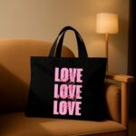 The "All We Need Is Love" Statement | Premium Black Canvas Tote bag - Image 2
