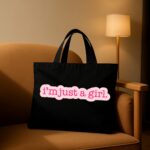 The "I'm Just A Girl" Viral Trend | Premium Black Canvas Tote bag - Image 2